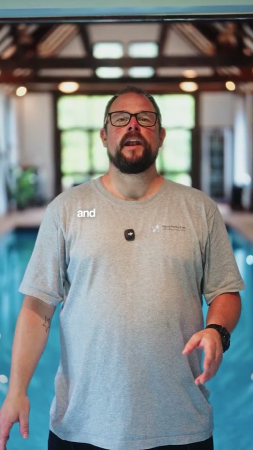 Aqua Perfection owner beside an indoor pool